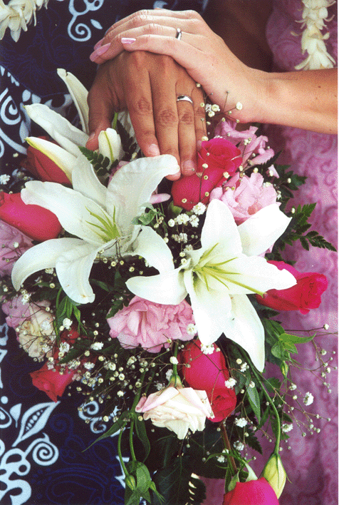 Gillian's Cascade is made with white Oriental Lilies bright pink Roses 